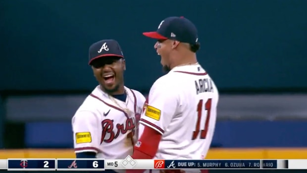 Ozzie Albies and Orlando Arcia celebrate after a play